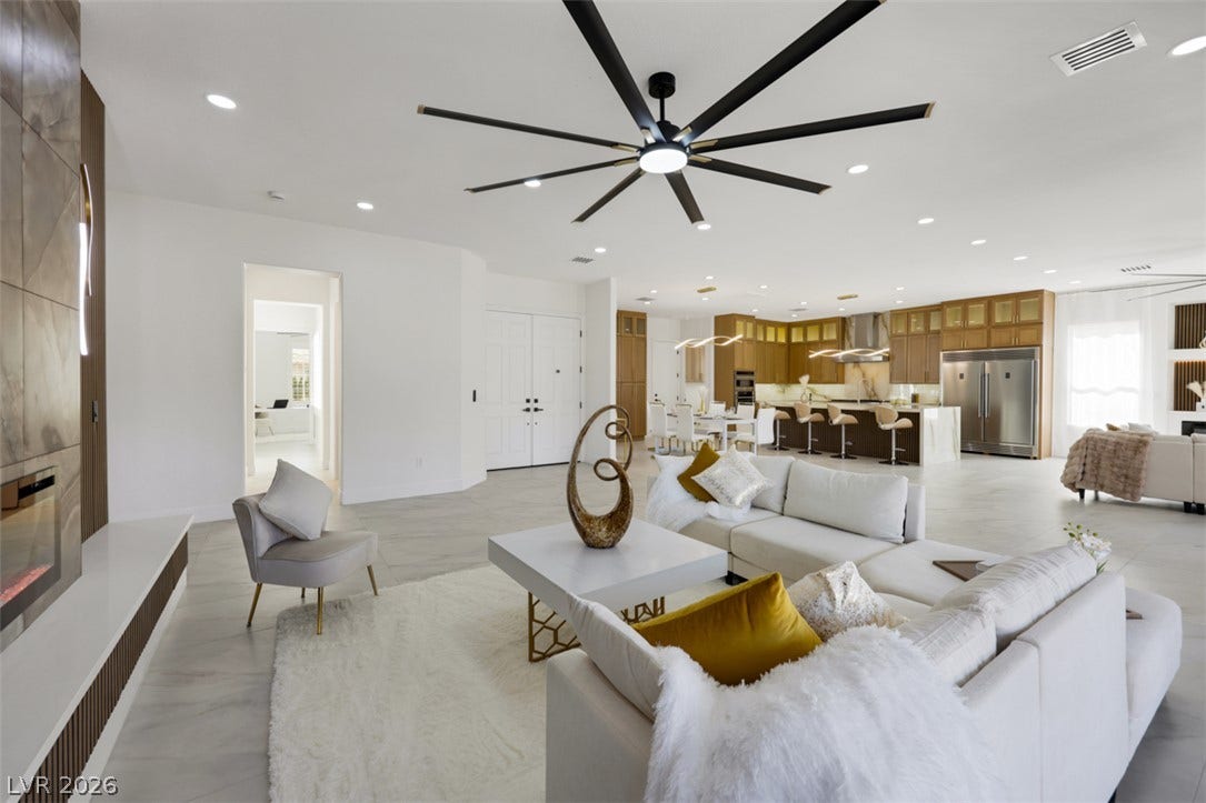 5015 Rivedro Street, Las Vegas, NV 89135 An open floorplan seamlessly connects the airy living area with the modern kitchen.