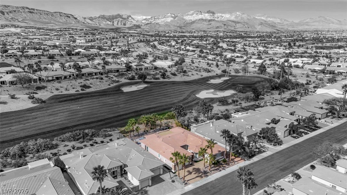 5015 Rivedro Street, Las Vegas, NV 89135 A golf course property backs directly onto pristine fairways with dramatic mountain backdrops.