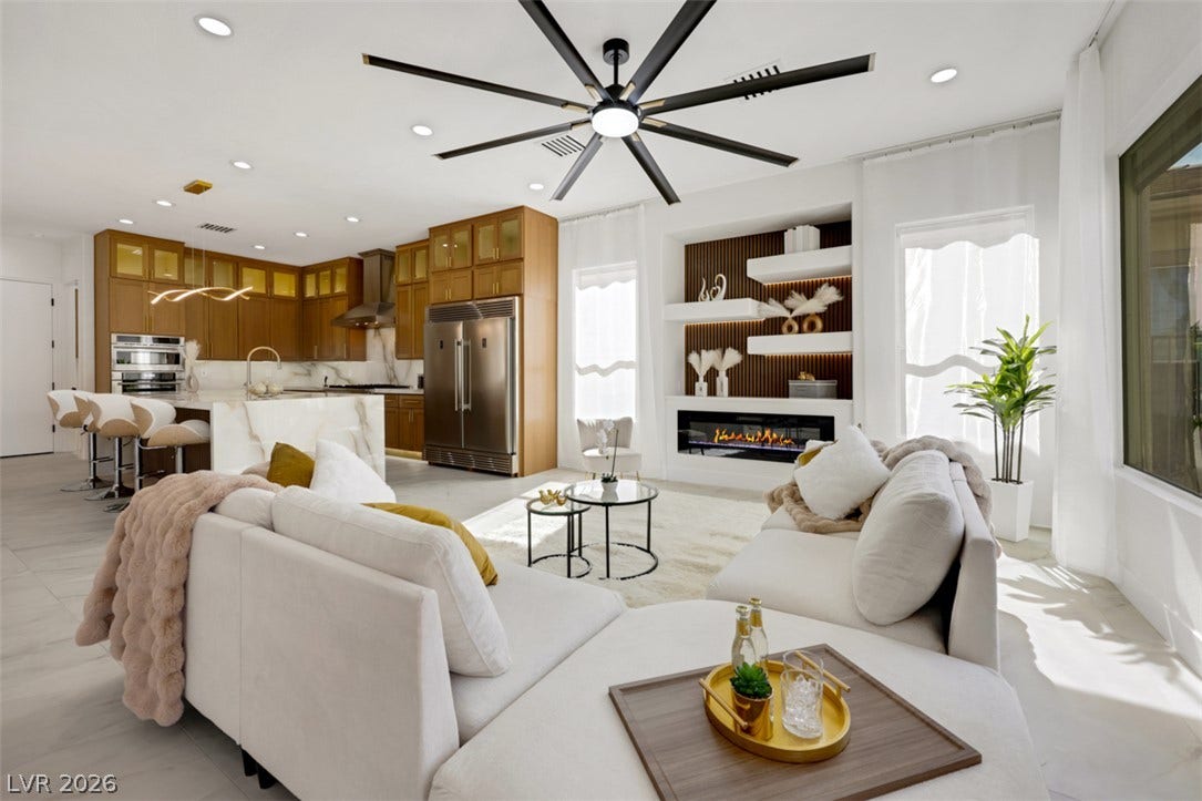 5015 Rivedro Street, Las Vegas, NV 89135 An open floor plan seamlessly connects the bright living space to a modern chef's kitchen.