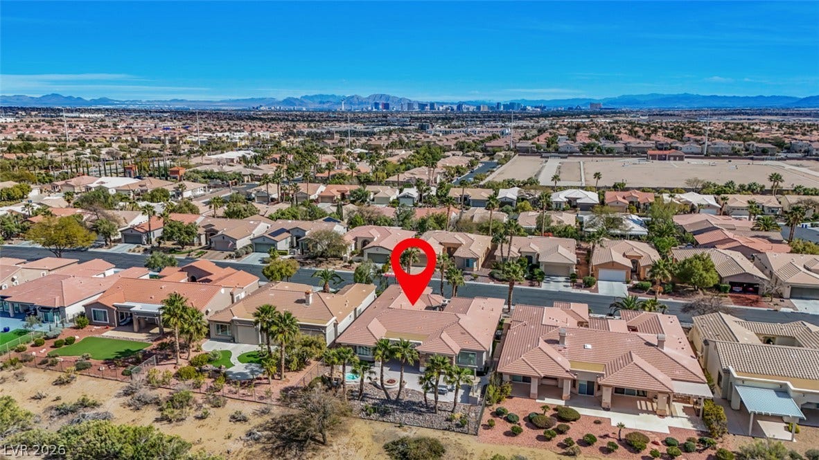 5015 Rivedro Street, Las Vegas, NV 89135 Distant city skyline and mountain views elevate this desirable neighborhood setting.