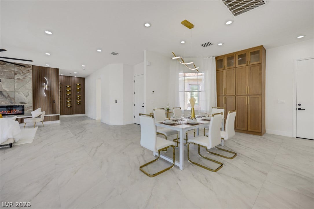 5015 Rivedro Street, Las Vegas, NV 89135 Polished tile flooring and an open layout create a seamless flow into the dining area.