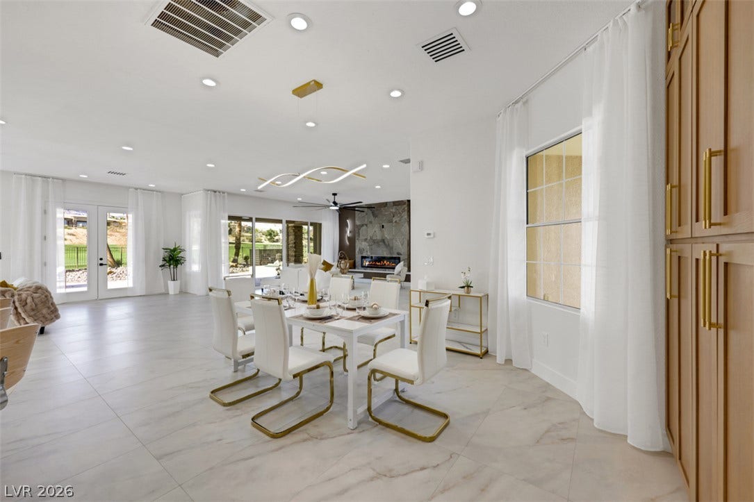 5015 Rivedro Street, Las Vegas, NV 89135 Gleaming tile floors and recessed lighting enhance this airy, open-concept dining area.