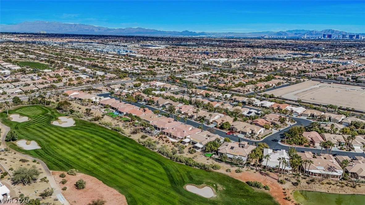 5015 Rivedro Street, Las Vegas, NV 89135 Panoramic mountain and city skyline views frame this pristine desert community alongside a premier golf course.