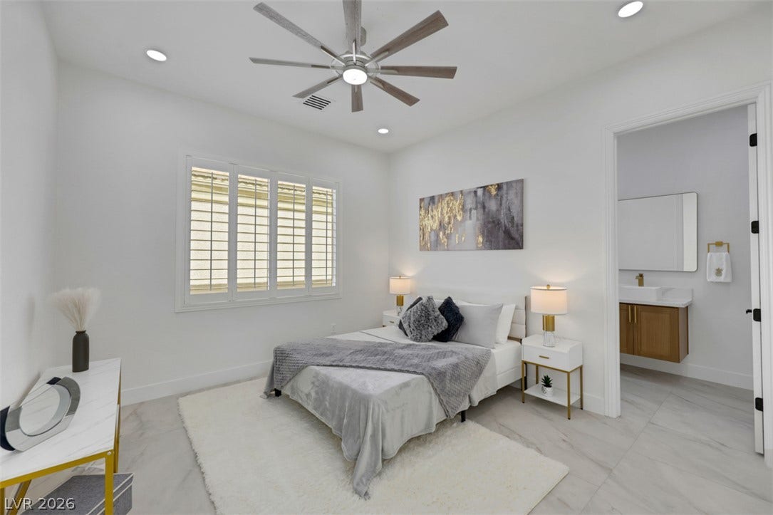 5015 Rivedro Street, Las Vegas, NV 89135 Smooth tile flooring and clean lines define this modern suite with an attached bathroom.