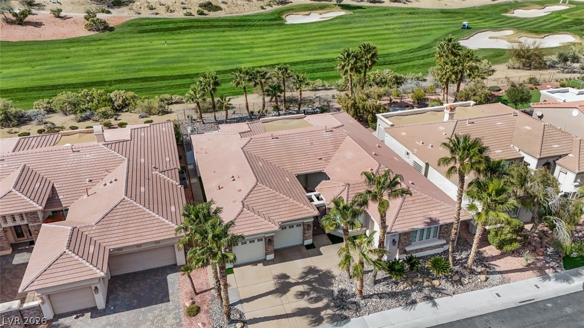 5015 Rivedro Street, Las Vegas, NV 89135 Tiled roofs and palm trees characterize this neighborhood bordering a lush golf course.