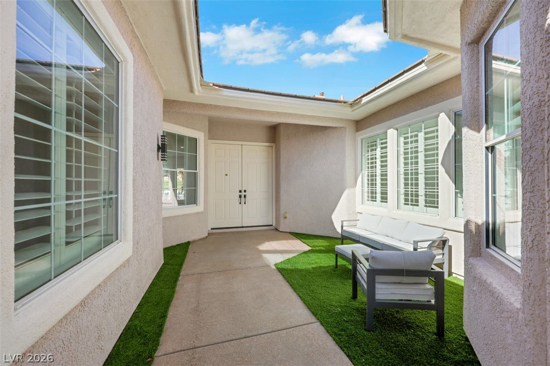 5015 Rivedro Street, Las Vegas, NV 89135 A private gated entry courtyard leads directly to double entry doors.