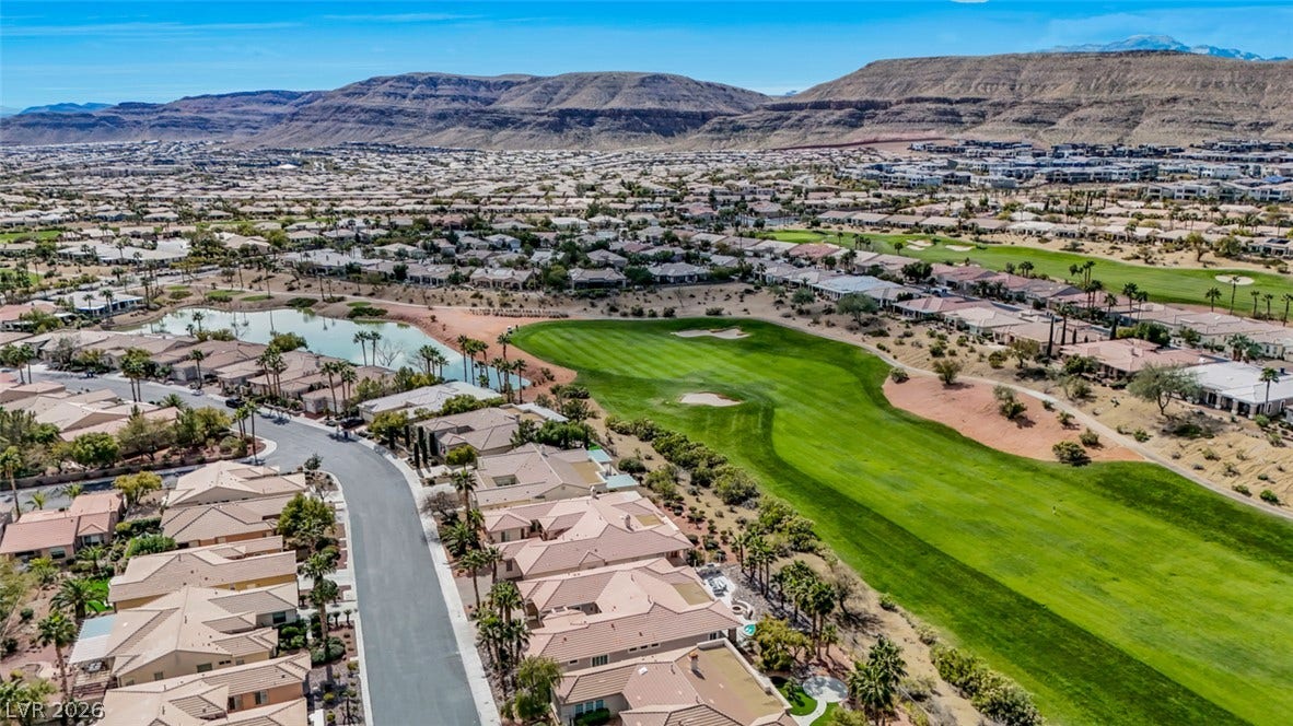 5015 Rivedro Street, Las Vegas, NV 89135 Sweeping mountain and golf course views frame this desert community.