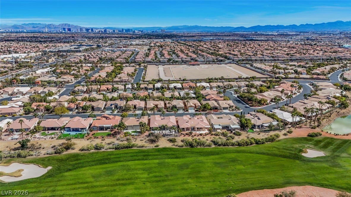 5015 Rivedro Street, Las Vegas, NV 89135 Sweeping mountain and city skyline views frame the vibrant golf course setting.