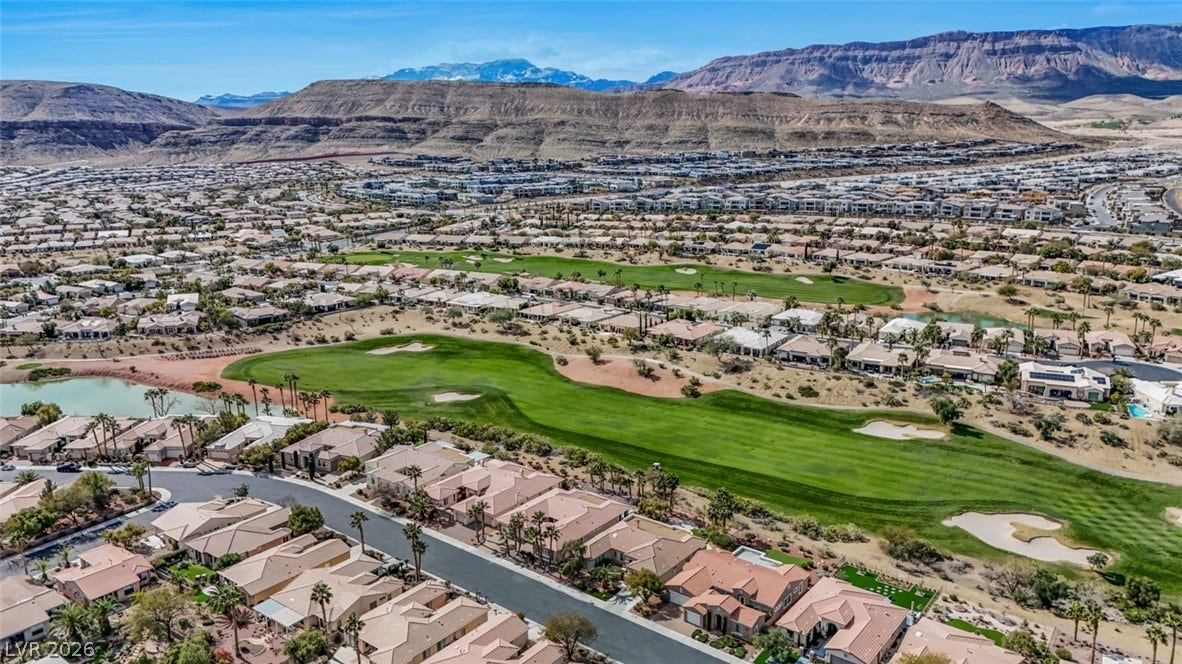 5015 Rivedro Street, Las Vegas, NV 89135 Sweeping mountain panoramas rise majestically above the surrounding desert neighborhood and golf course fairways.