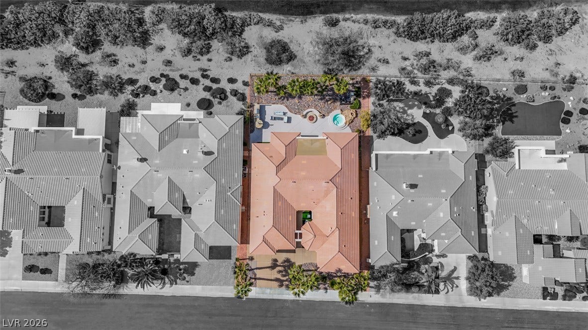 5015 Rivedro Street, Las Vegas, NV 89135 An aerial perspective reveals the classic tile roof structure nestled within a quiet neighborhood.
