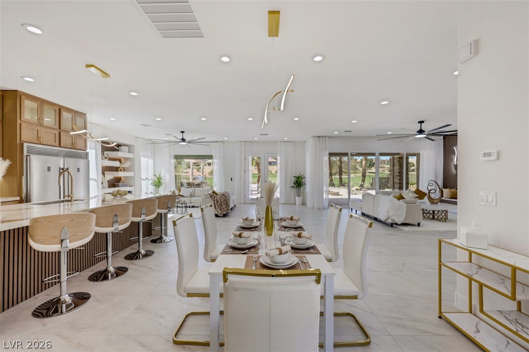 5015 Rivedro Street, Las Vegas, NV 89135 Gleaming tile floors and recessed lighting enhance this airy, open-concept dining area.
