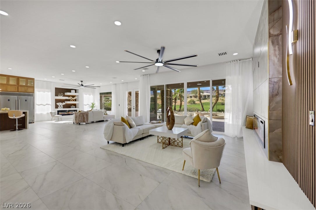 5015 Rivedro Street, Las Vegas, NV 89135 Polished tile flooring and seamless sliding glass doors define this airy open floor plan.