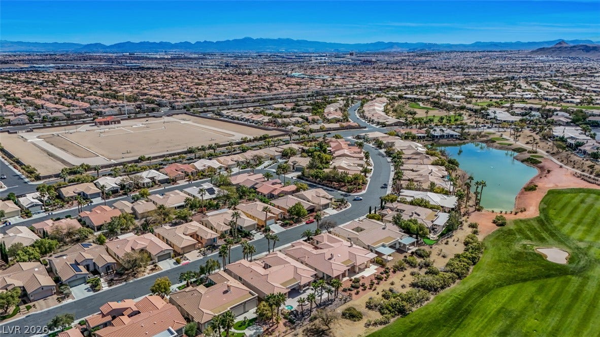 5015 Rivedro Street, Las Vegas, NV 89135 Panoramic mountain and water views define this expansive desert community setting.