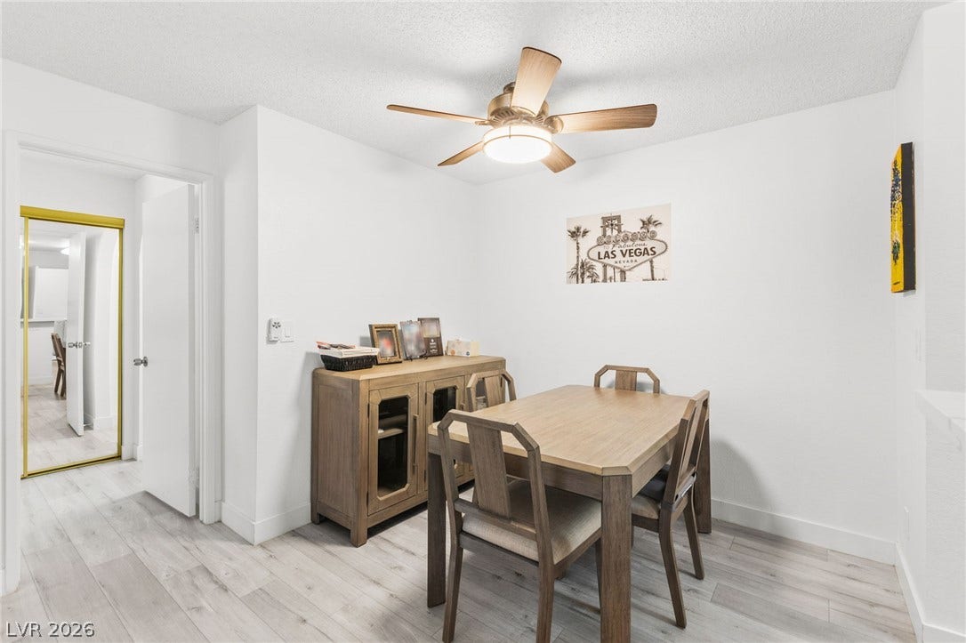 2200 S Fort Apache Road, #2156, Las Vegas, NV 89117 A streamlined dining space with a natural wood dining set, perfect for everyday meals.