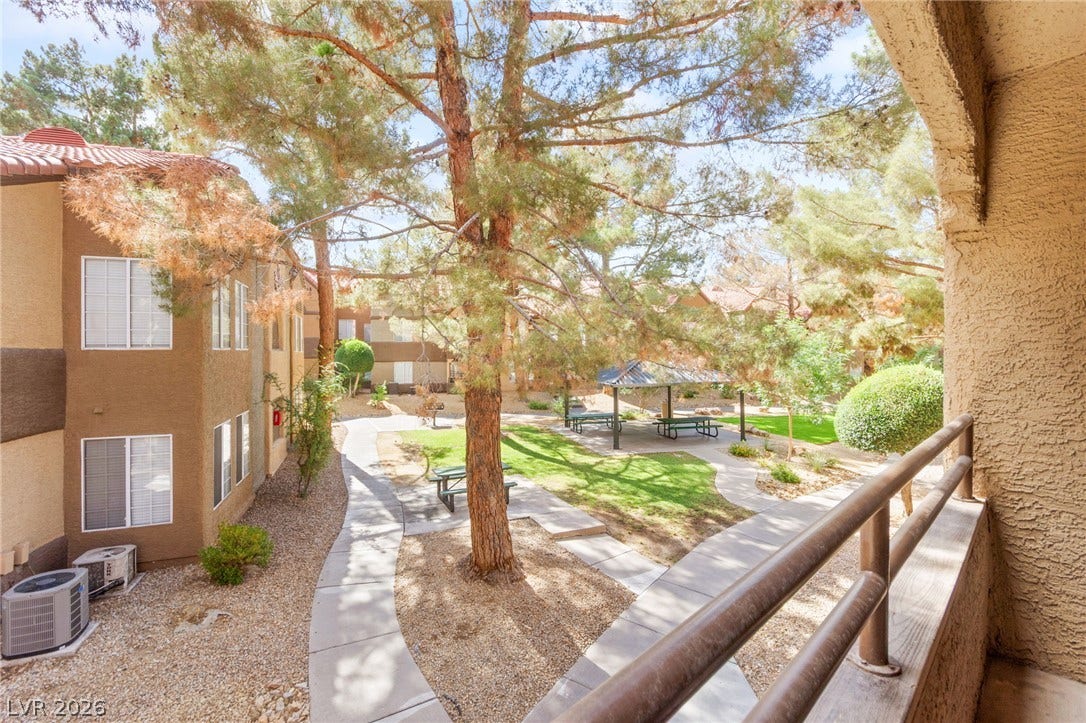 2200 S Fort Apache Road, #2156, Las Vegas, NV 89117 A well-maintained community space offers a tranquil escape with shaded pathways and a gathering pavilion.