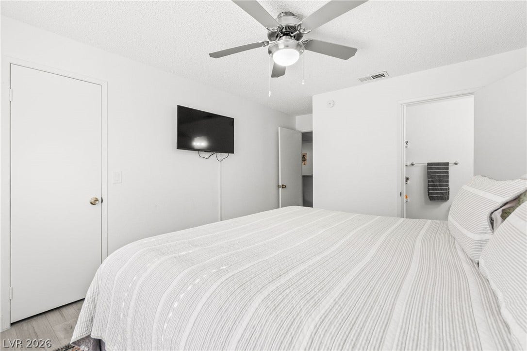 2200 S Fort Apache Road, #2156, Las Vegas, NV 89117 Relax in this well-lit bedroom featuring practical flooring and a convenient attached bathroom access.