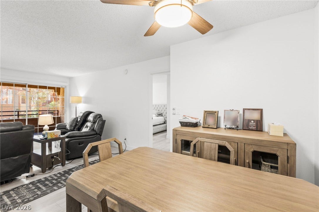 2200 S Fort Apache Road, #2156, Las Vegas, NV 89117 An open-concept living and dining area provides a bright and airy atmosphere, perfect for comfortable living.