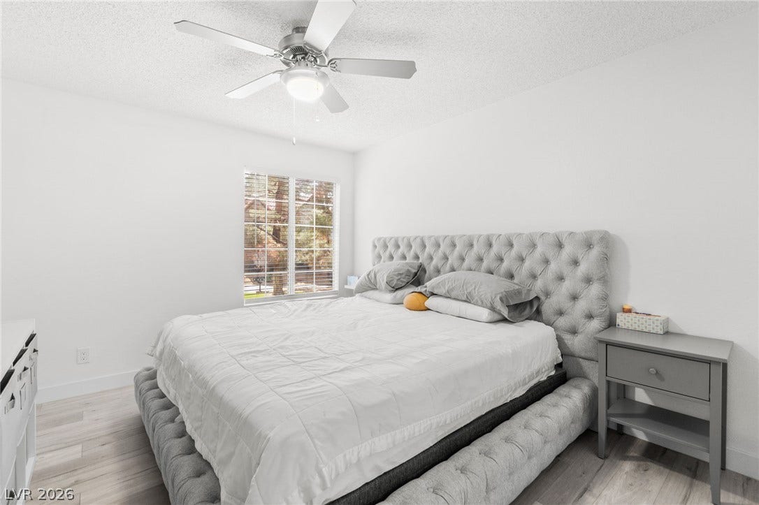 2200 S Fort Apache Road, #2156, Las Vegas, NV 89117 Well-lit sleeping quarters feature sleek hardwood floors and a modern ceiling fan for ultimate comfort.