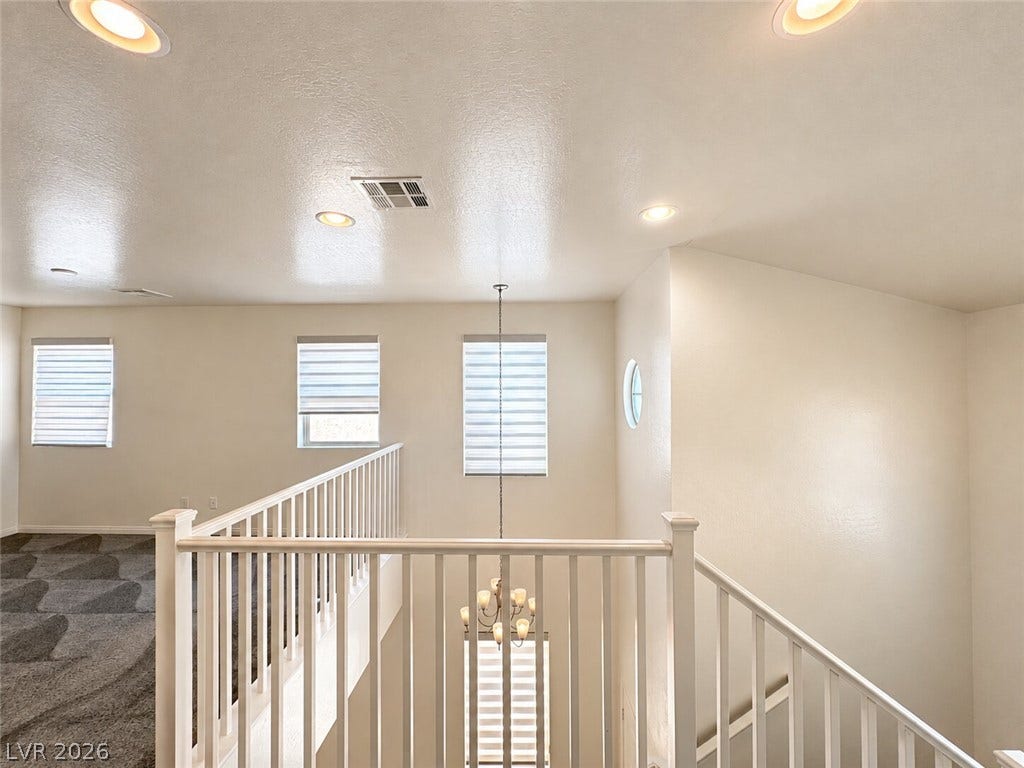 Clean lines and a spacious layout define this versatile upper-level landing.