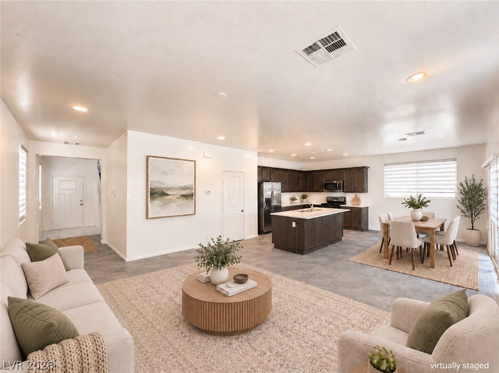 An open floor plan seamlessly connects the main living areas with the modern kitchen.