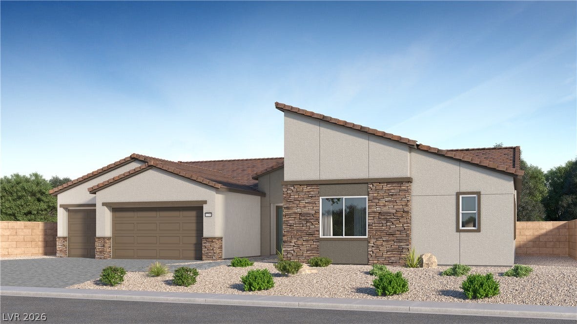 7150 Zero Carbon Avenue, Las Vegas, NV 89113 Striking contemporary architecture pairs textured stone accents with a clean stucco exterior.