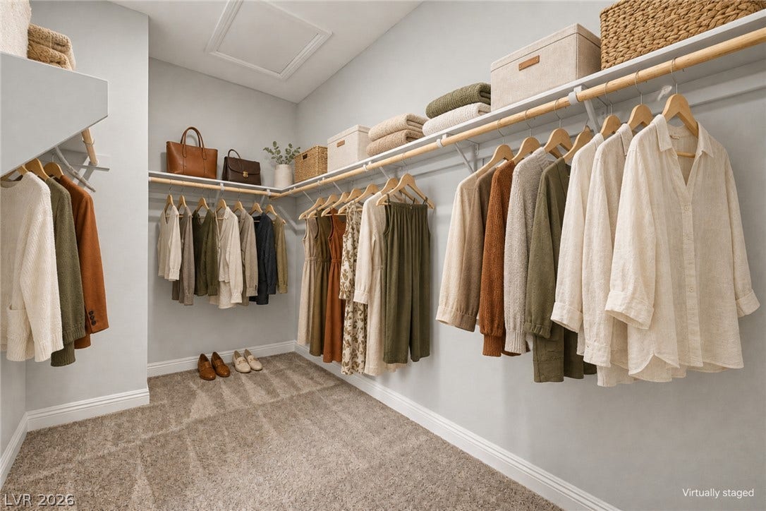 4618 Summer Azure Street, North Las Vegas, NV 89031 Ample hanging space and built-in shelving define this organized walk-in closet with soft carpeting.