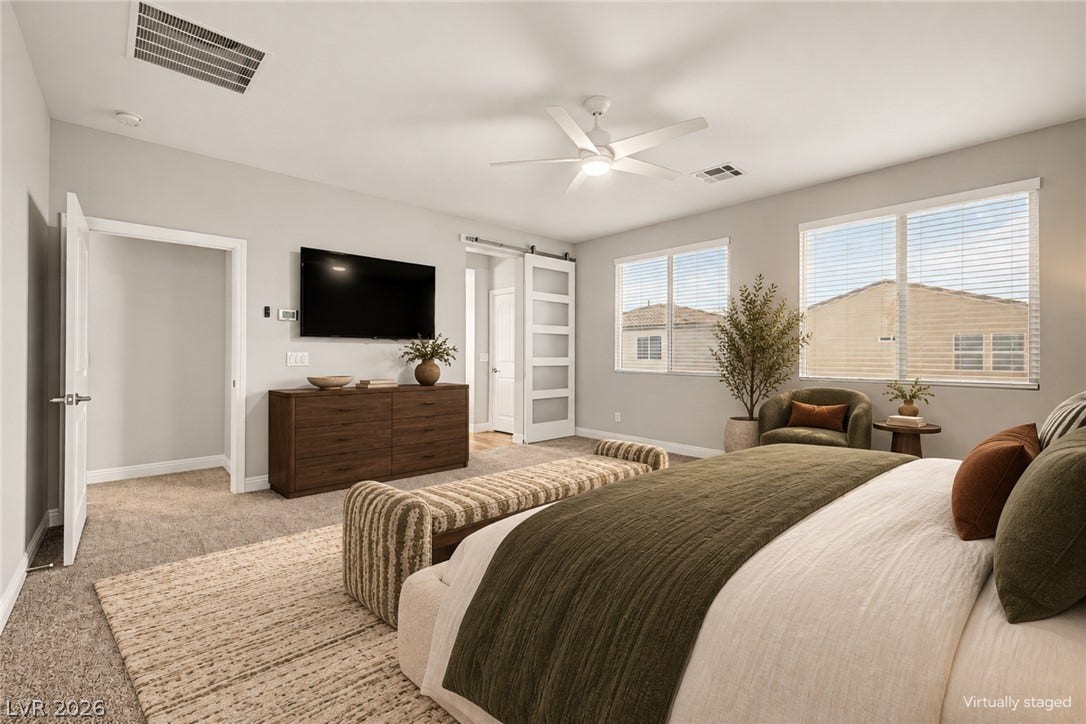 4618 Summer Azure Street, North Las Vegas, NV 89031 Plentiful windows fill this peaceful sleeping space with natural light.