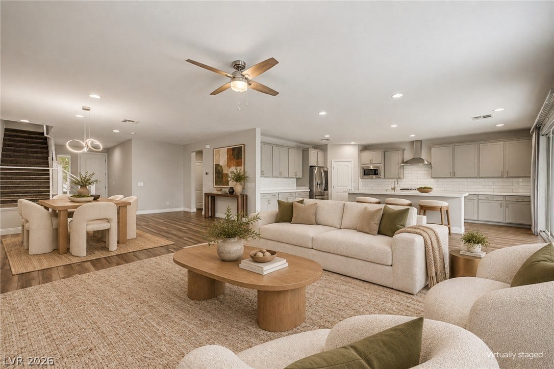 4618 Summer Azure Street, North Las Vegas, NV 89031 An open floor plan connects the relaxed living area directly to the kitchen and dining spaces.