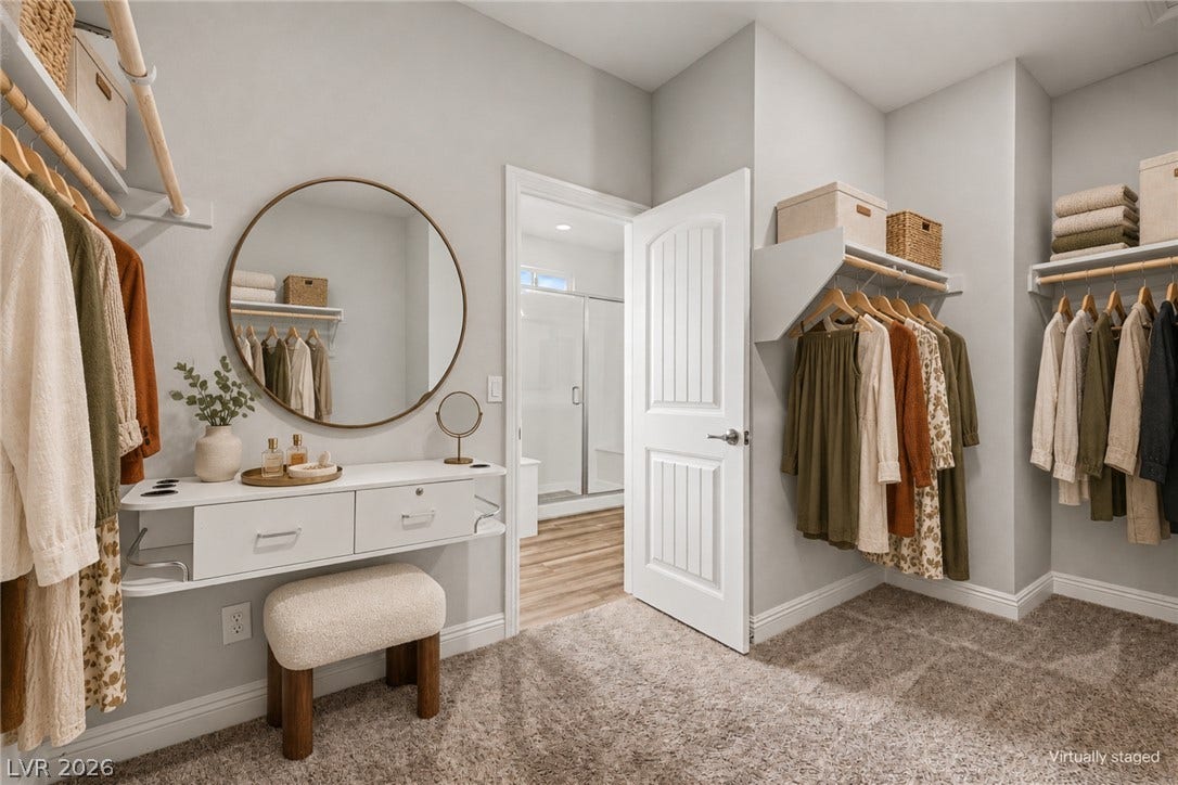 4618 Summer Azure Street, North Las Vegas, NV 89031 Ample storage options and soft carpeting define this functional walk-in closet space.