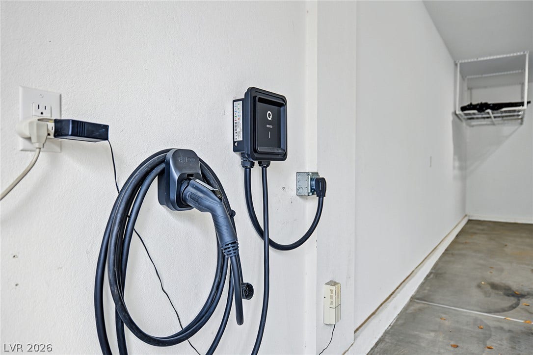 4618 Summer Azure Street, North Las Vegas, NV 89031 An electric vehicle charging station mounts securely to the wall of this garage.