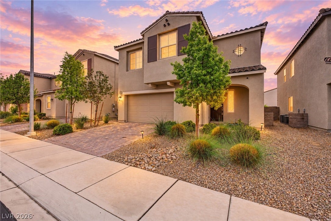 4618 Summer Azure Street, North Las Vegas, NV 89031 Stucco exterior finishes and tile roofing define this multi-level home with desert-adapted landscaping.