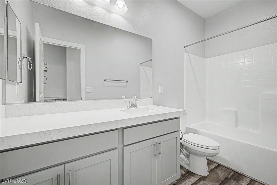 4618 Summer Azure Street, North Las Vegas, NV 89031 A spacious vanity and shower tub combination complete this modern bathroom space.