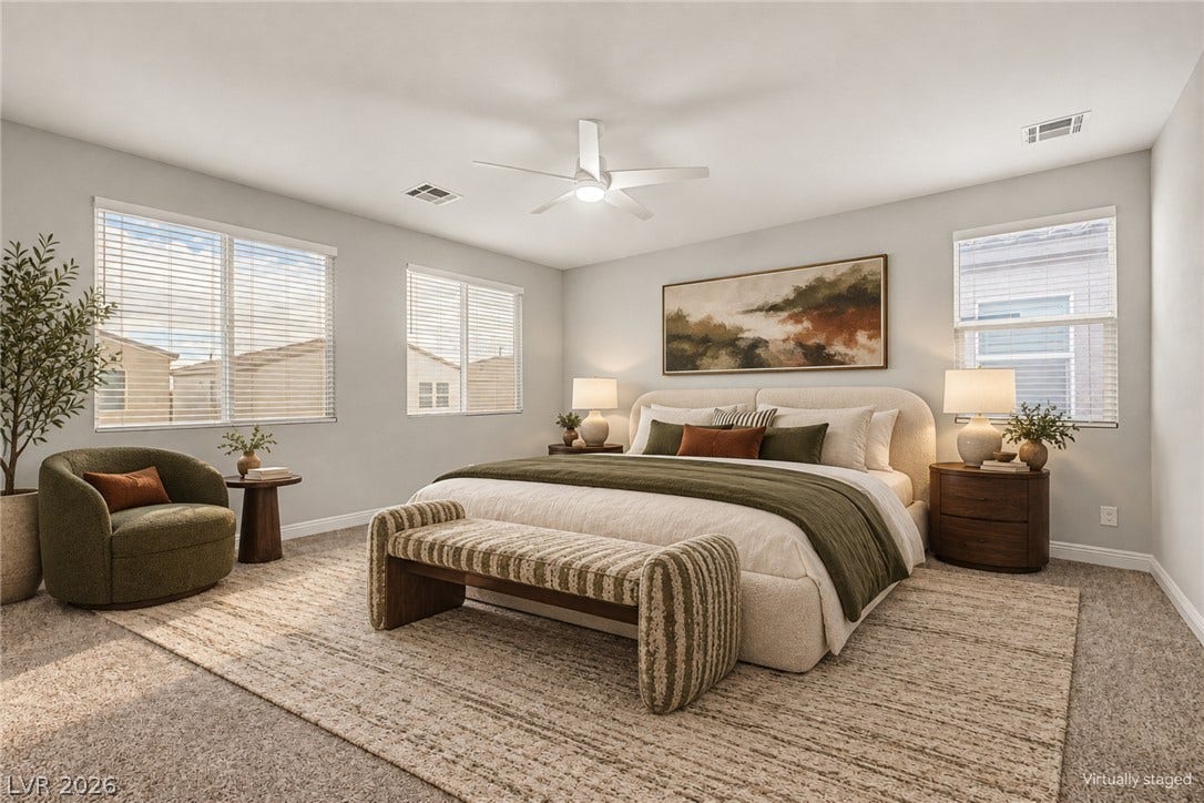 4618 Summer Azure Street, North Las Vegas, NV 89031 Plentiful natural light streams through multiple windows highlighting the spacious bedroom layout.
