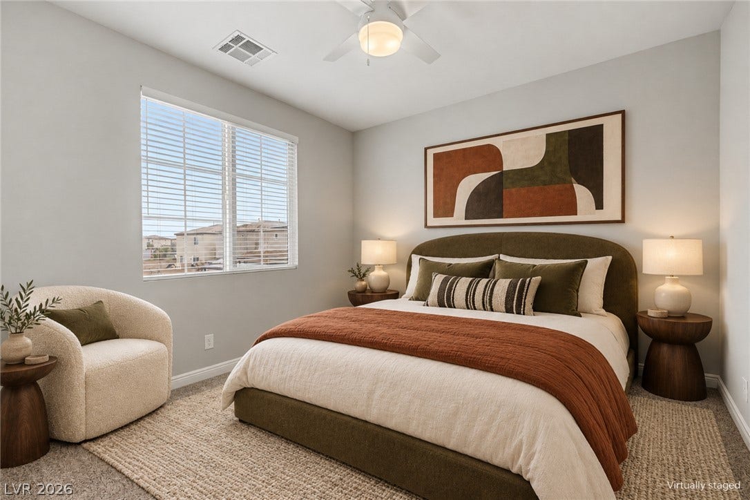 4618 Summer Azure Street, North Las Vegas, NV 89031 Plush carpeting and a large window set a tranquil tone in this bedroom.