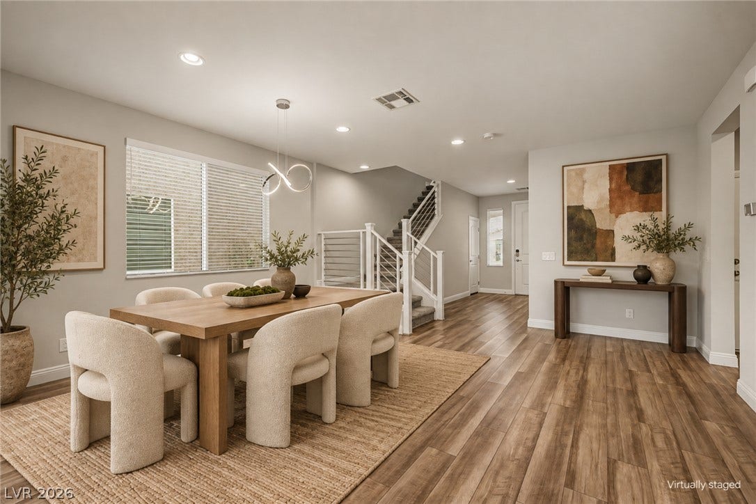 4618 Summer Azure Street, North Las Vegas, NV 89031 Gleaming wood floors and a contemporary staircase anchor this welcoming dining area.