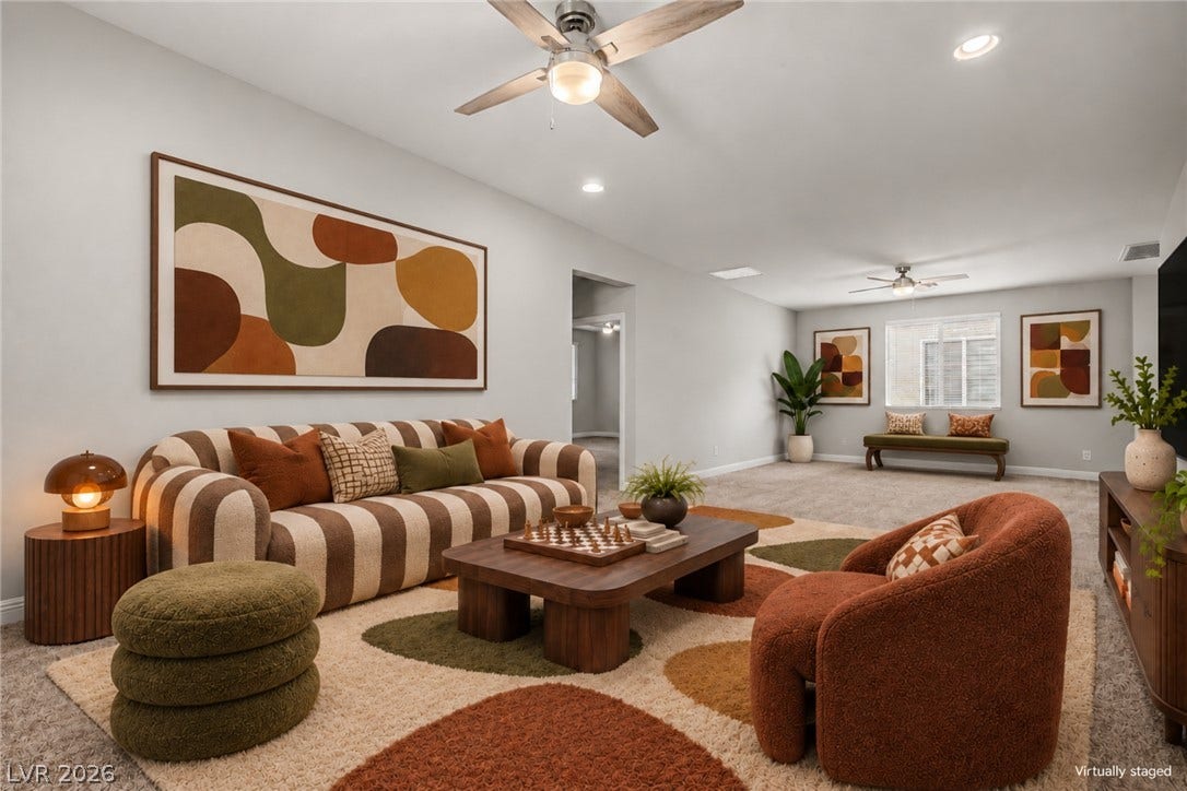 4618 Summer Azure Street, North Las Vegas, NV 89031 Recessed lighting and soft carpeting create a cozy, open atmosphere throughout this versatile living space.