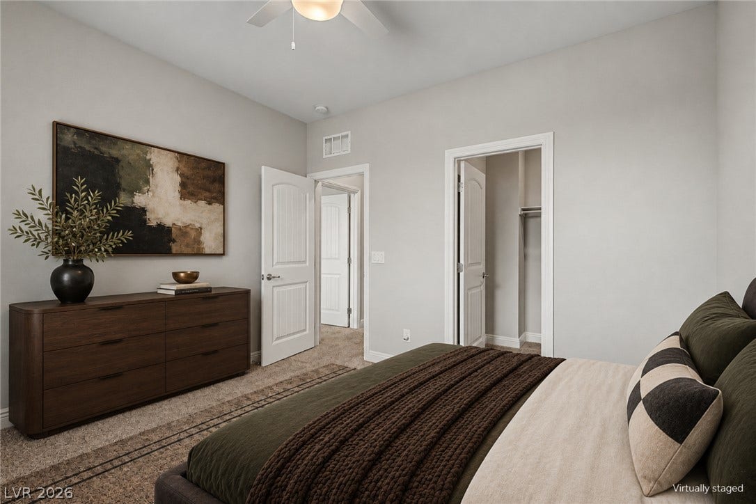 4618 Summer Azure Street, North Las Vegas, NV 89031 Smooth walls and classic trim elevate this comfortable bedroom with an attached walk-in closet.
