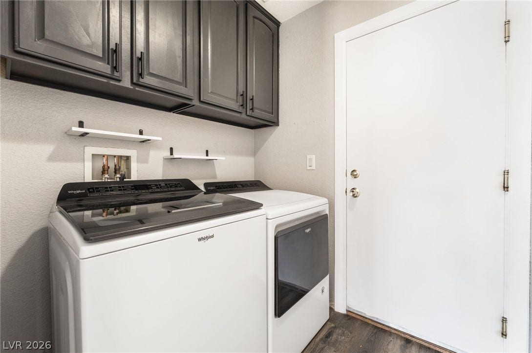 6527 Velvet Silk Street, North Las Vegas, NV 89084 Dark cabinetry adds to this laundry room located right off the garage and entering into the kitchen.
