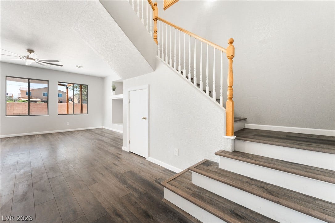 6527 Velvet Silk Street, North Las Vegas, NV 89084 An open entryway showcases a classic wooden staircase with plenty of storage underneath.