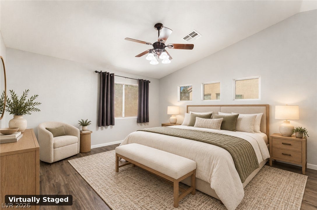 6527 Velvet Silk Street, North Las Vegas, NV 89084 Virtually staged - Primary bedroom features high vaulted ceilings, natural light and LVP flooring.