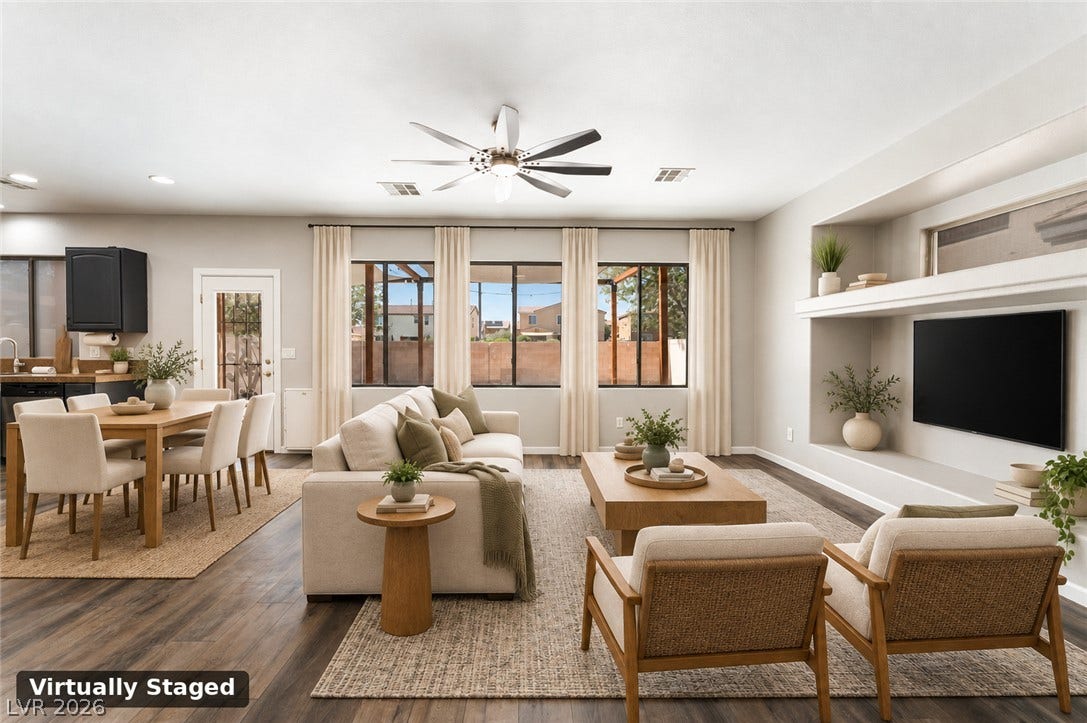 6527 Velvet Silk Street, North Las Vegas, NV 89084 Virtually staged - An open floorplan seamlessly connects the airy living area to the adjacent dining space.