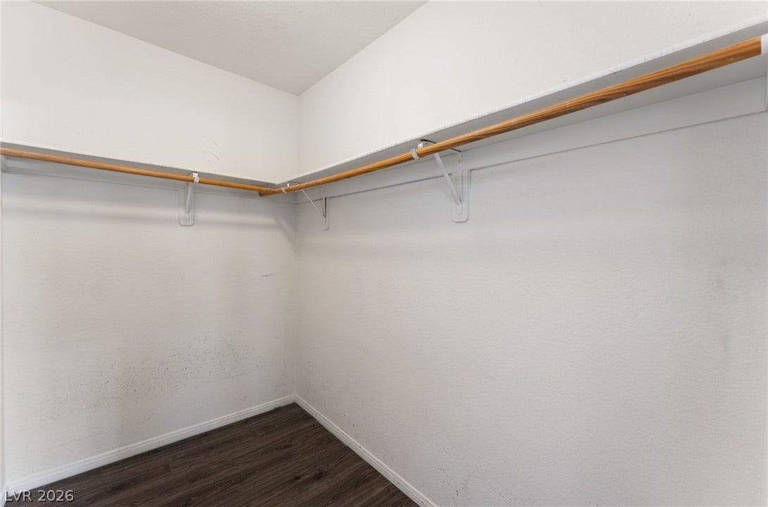 6527 Velvet Silk Street, North Las Vegas, NV 89084 Ample hanging space highlights this functional walk-in closet.