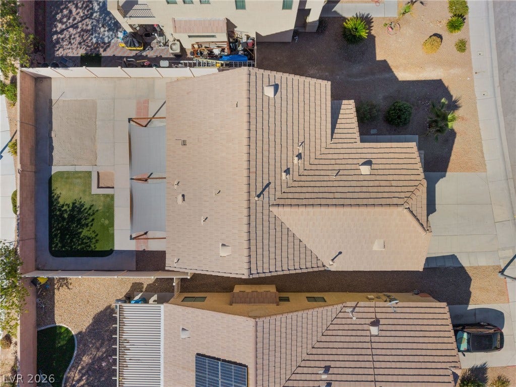 6527 Velvet Silk Street, North Las Vegas, NV 89084 An aerial overhead perspective highlights the tile roof and fenced back yard design.