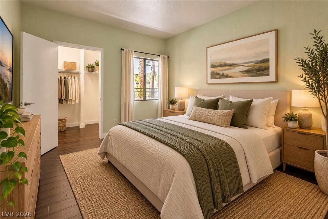 8250 N Grand Canyon Drive, #1006, Las Vegas, NV 89166 Digitally Staged* Rich hardwood flooring pairs with a large window and a nearby walk-in closet.