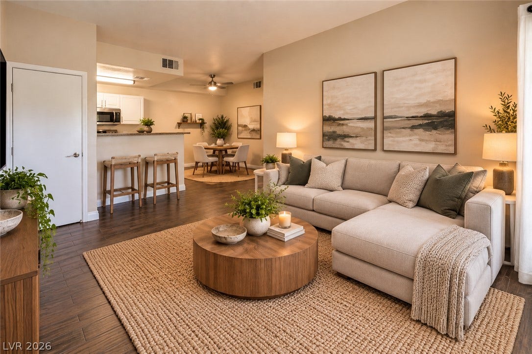 8250 N Grand Canyon Drive, #1006, Las Vegas, NV 89166 Digitally Staged* An open floor plan seamlessly connects the comfortable living space to the kitchen and dining area.
