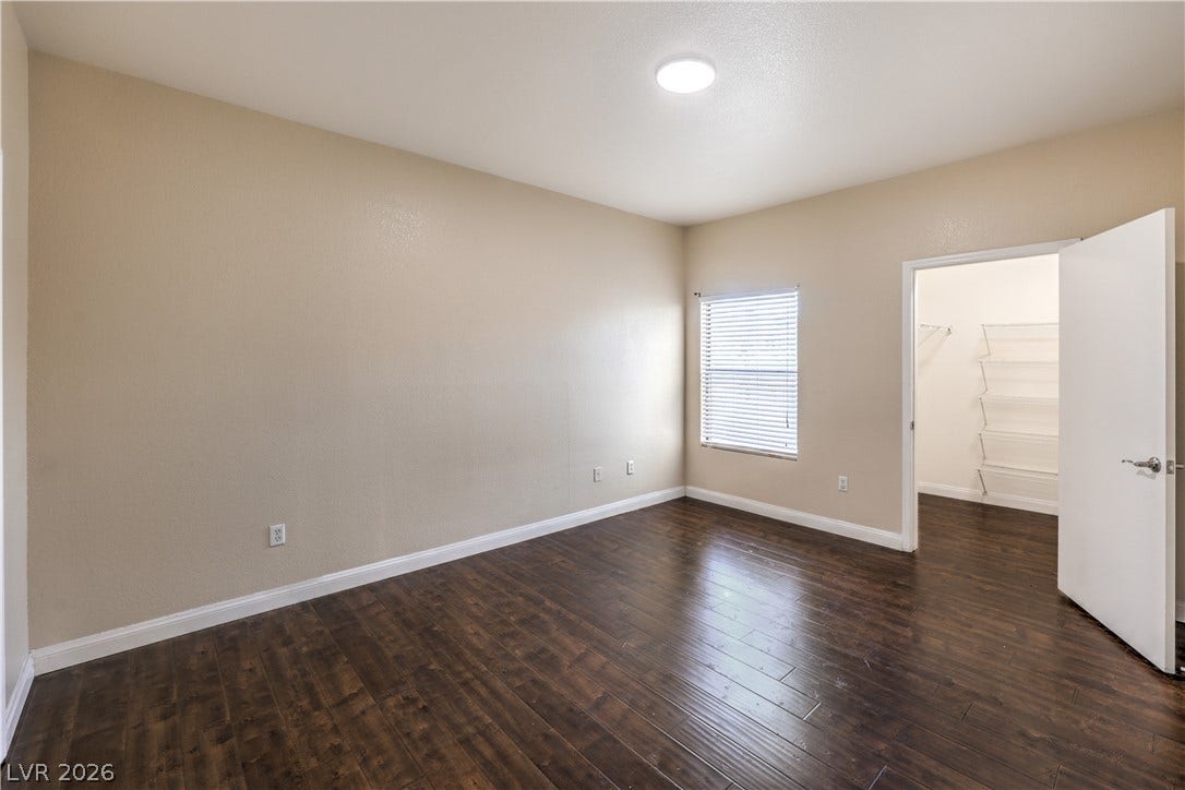 8250 N Grand Canyon Drive, #1006, Las Vegas, NV 89166 Rich wood-inspired flooring pairs beautifully with neutral walls and a spacious closet.