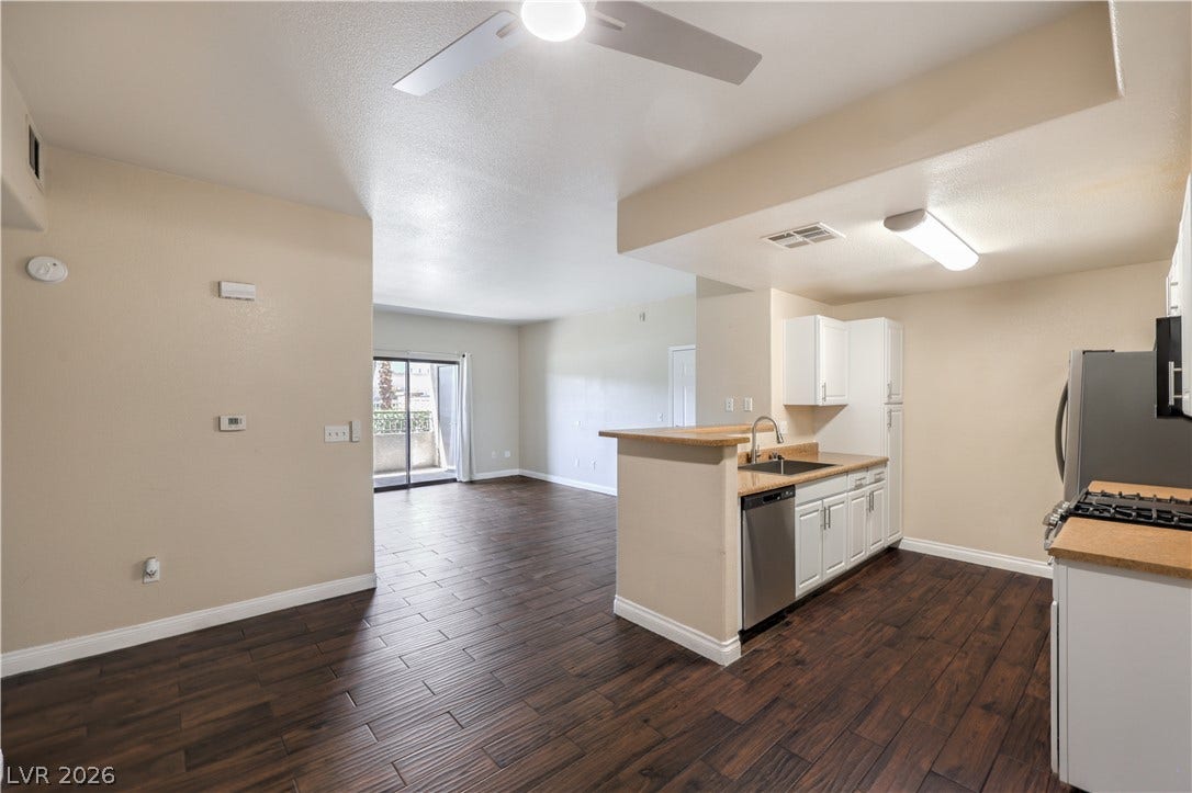 8250 N Grand Canyon Drive, #1006, Las Vegas, NV 89166 Gleaming wood floors anchor an airy, open layout with a practical kitchen bar.