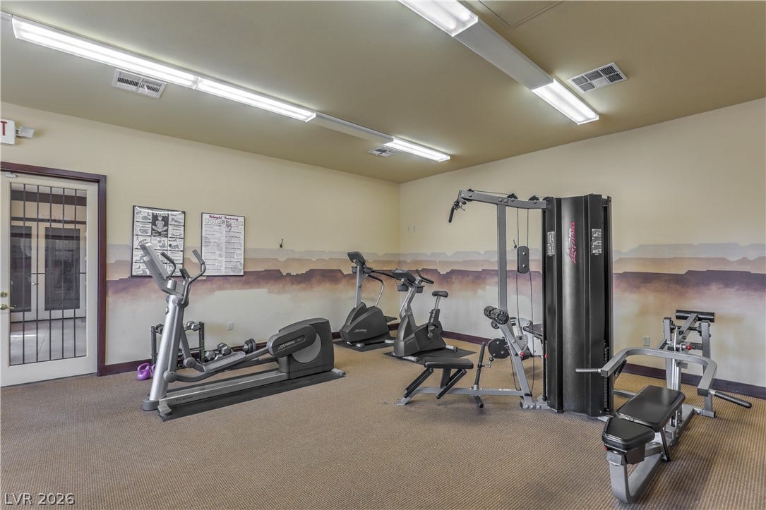 8250 N Grand Canyon Drive, #1006, Las Vegas, NV 89166 A spacious exercise room with durable carpeting and glass doors leading outside.