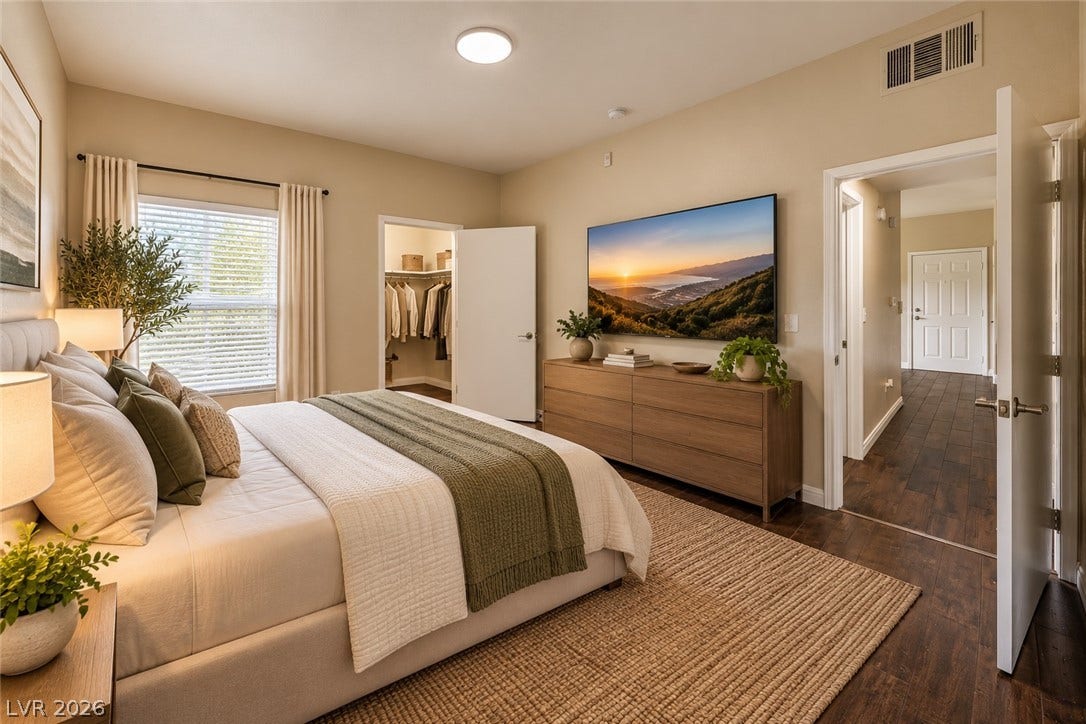 8250 N Grand Canyon Drive, #1006, Las Vegas, NV 89166 Digitally Staged* Rich hardwood floors and a spacious walk-in closet highlight this inviting bedroom retreat.