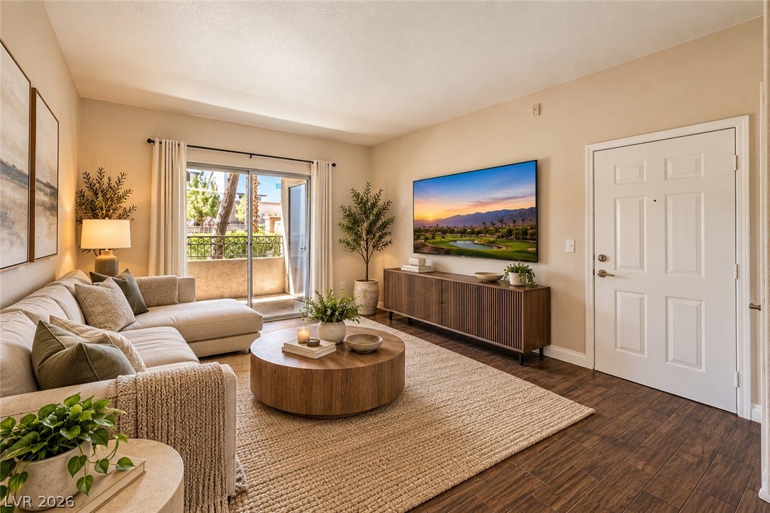 8250 N Grand Canyon Drive, #1006, Las Vegas, NV 89166 Digitally Staged* Glass sliding doors open to a private balcony from this inviting main living area.